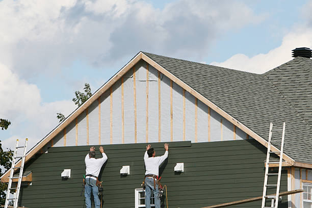 Professional Siding technician working in Devon, PA